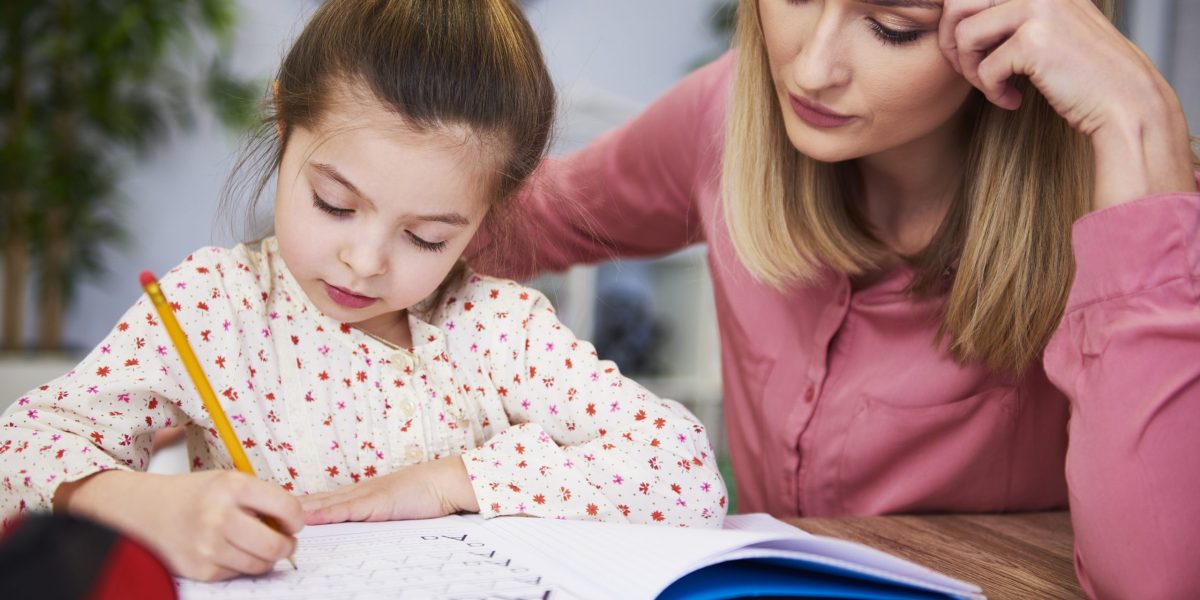 focused-mother-helping-child-with-homework-2021-08-27-09-59-53-utc-scaled-1